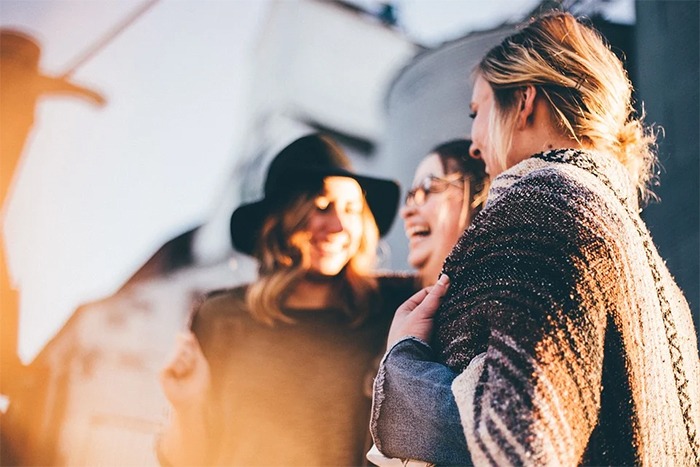 women talking, socializing, laughing