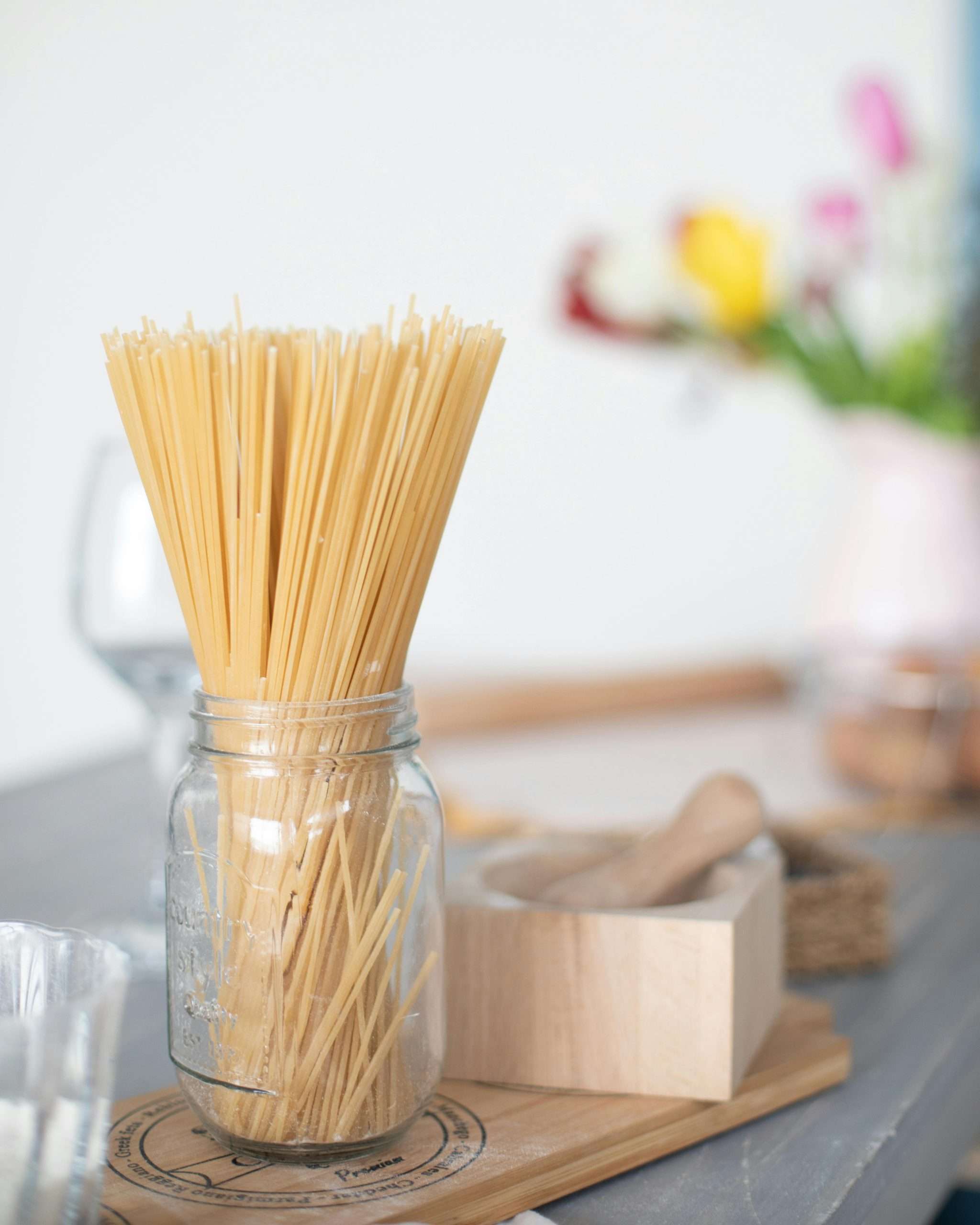 spaghetti noodles inside a glass jar