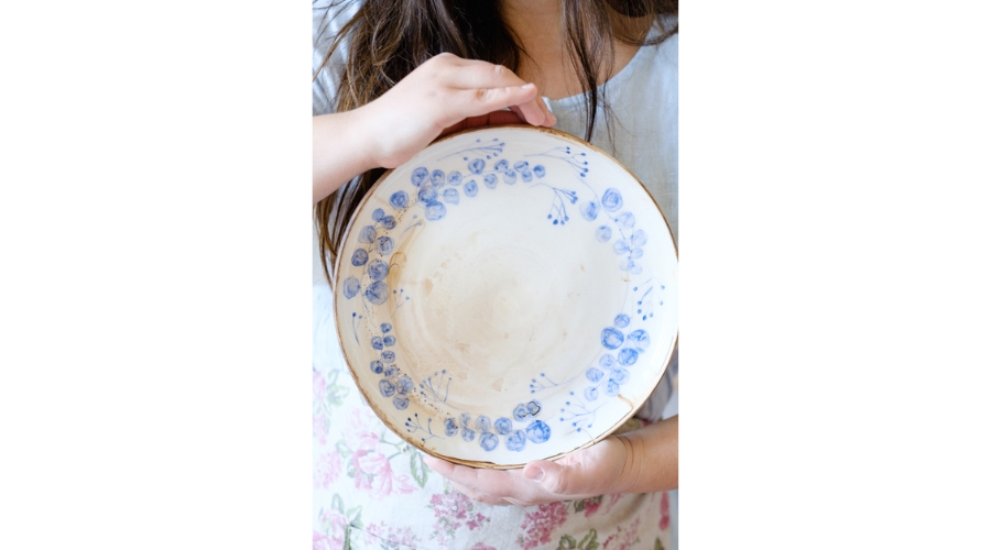 A ceramic plate designed with bluebonnets