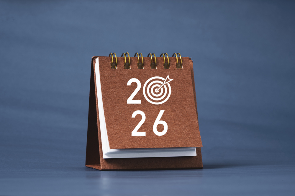 2026 with dartboard with arrow on calendar and copy space for setup new business target in new year concept