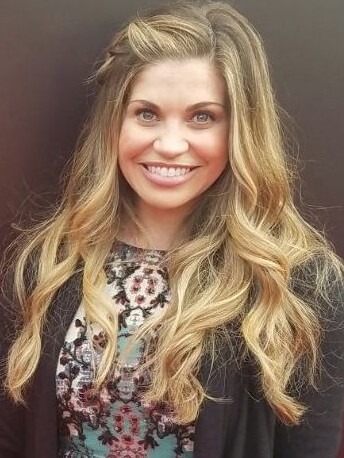 Danielle Fishel smiling at the camera at the Emmy Awards