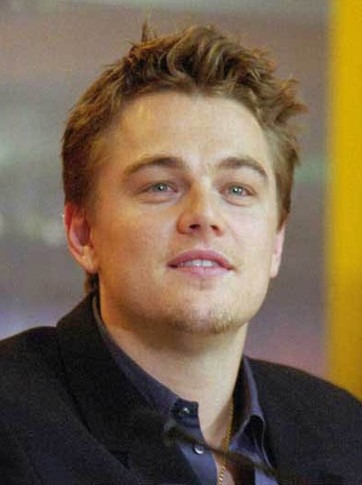a white young man with brown hair in a suit